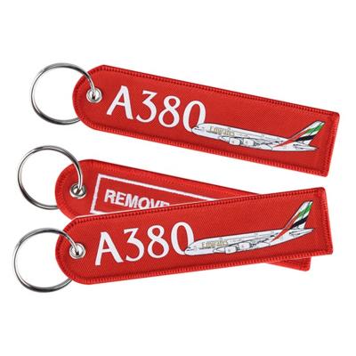 China Promotion custom logo remove flight twill keychains embroidered on two sides for sale