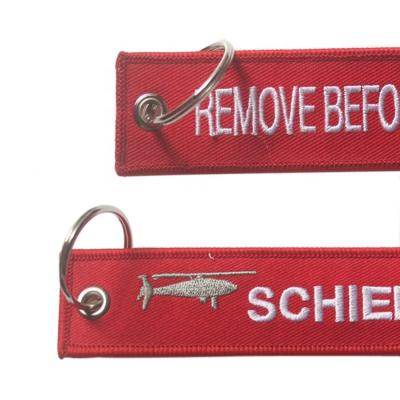 China Promotion 100pcs Minimum Flight Red Embroidery Key Chain With Both Sides Logo Custom for sale