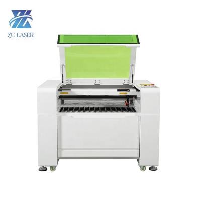 China Laser CUTTING CO2 6090 Laser Engraving Machine And Cutting Machine Applied To Silicone Rubber for sale