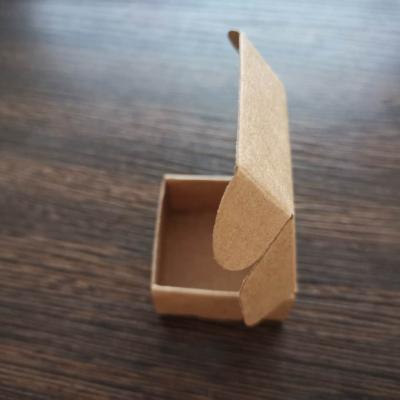 China Small Stock 4*4*2cm Essential Oil Bottle Flip Package Box Small Soap Packaging Biodegradable Paper Box for sale