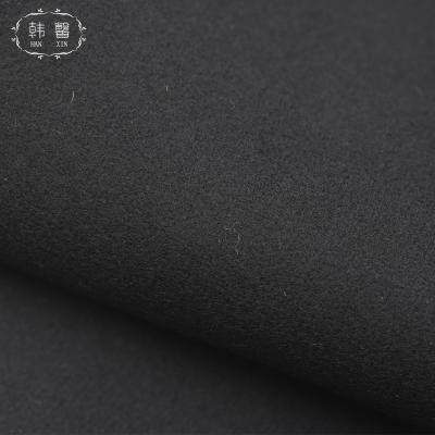 China DIMENSIONAL black thick woolen fabric of autumn and winter coat pants of wool fabric 680g of woolen fabric overcoat stain for sale