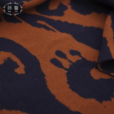 China Viable made in China woolen coat fabric 620g spring winter blue coat skirt caramel jacquard wool fabric for sale