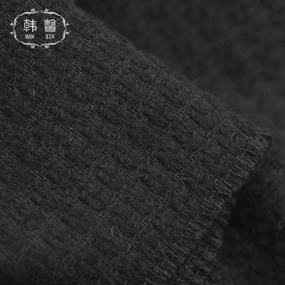 China Autumn and winter fancy yarn fabric 480g woolen coat fabric 480g breeze fragrant coat skirt wind fragrant black woven woolen wool fabric for sale