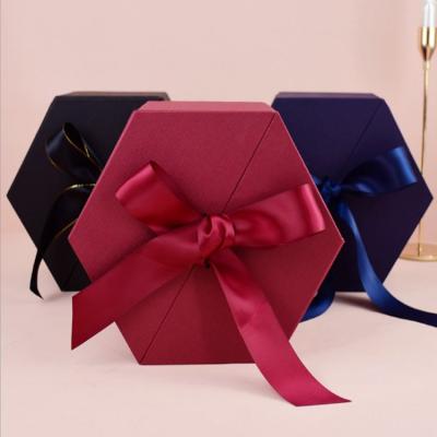 China Recycled Materials Bowknot Cardboard Flower Paper Gift Packaging Box Hexagon High End Gift Box for sale