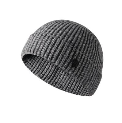 China JOINT Fashion Men's Winter Beanie Hats Outdoor Knitted Wool Warm Hat With Button for sale