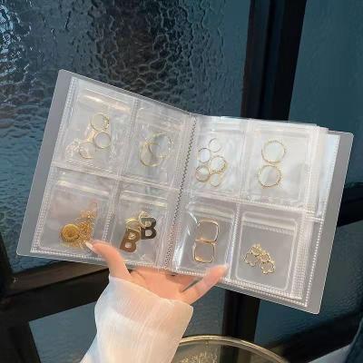 China Transparent Book Dustproof Jewelry Organizer Travel Jewelry Storage Earrings Stud Necklace Ring Bracelet Organizer Album 80 Grids for sale