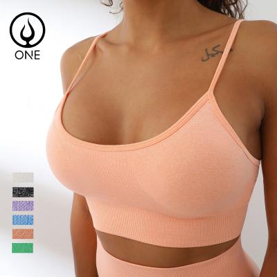 China Breathable Women Padded Seamless Full Body Workout Crop Push Up Sports Bras In Solid Color for sale