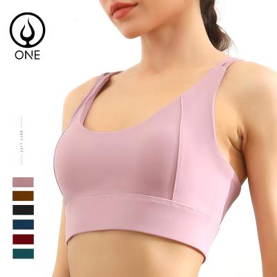 China Strappy Women Breathable Workout Racerback Sports Bras Sexy Back Padded Yoga Short Sleeve Crop Tops With Built In Bras In Solid Colors for sale