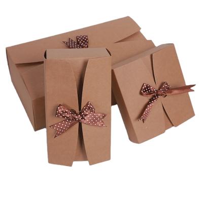 China Christmas Recyclables Custom Logo Folding Kraft Paper Gift Craft Announcement Paper Packaging Box With Ribbon Closure for sale