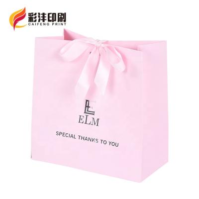 China 2021 Wholesale Custom Printed Disposable Factory Logo Gift Craft Shopping Paper Bag Wedding Gift Bag With Ribbon Handles for sale