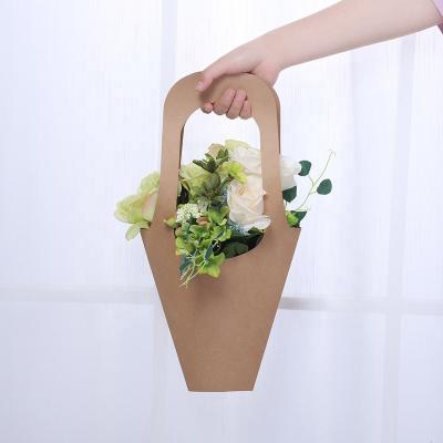 China Recyclable Flower Shop Hanging Kraft Paper Flower Packaging Bag With Paper Handle for sale