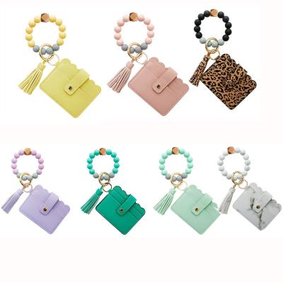 China Fashion Rubber Top Silicone Beaded Key Ring Bracelet Wristlet Keychain With Card Wallet For Women for sale