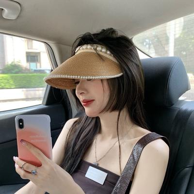 China Sun Fashoion Women's Empty Top Straw Hats Pearl Foldable Straw Hat Wide Big Brim Beach Travel Summer Hats Straw Hats for sale