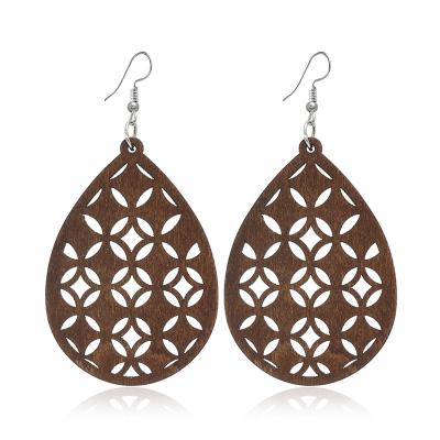 China FASHIONABLE hot selling wooden earrings European and American fashion exaggerated geometric hollow wooden earrings for sale