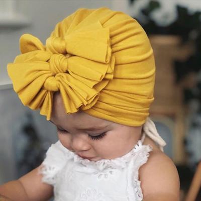 China Imitate Animal Soft Knitted Kids Many Colors Outdoor Hats Bowknot Baby Winter Hats For 0-4 Years Old for sale