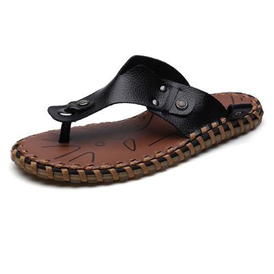 China Fashion Trend Rivet Stud Suture Top Handwork Genuine Leather Non-slip Flat Unique Lanyard Flip Flops For Men For Men for sale