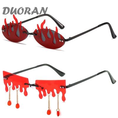 China 2022 Women's Trendy Rimless Fashion Sunglasses Funny Tassel Flame Shaped Sun Glasses For Ladies Shades Steampunk Glasses UV400 for sale