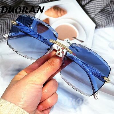 China Wholesale Fashion Rimless Women's Crystal Sunglasses Diamond Rimless Small Luxury Rectangle Sunglasses For Women for sale