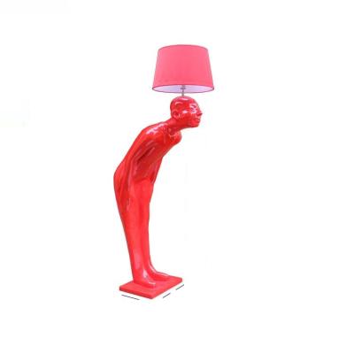 China Modern Artistic Hot Sale Resin Sculpture Floor Lamps Red Man Reception Hotel Door Floor Lamp for sale