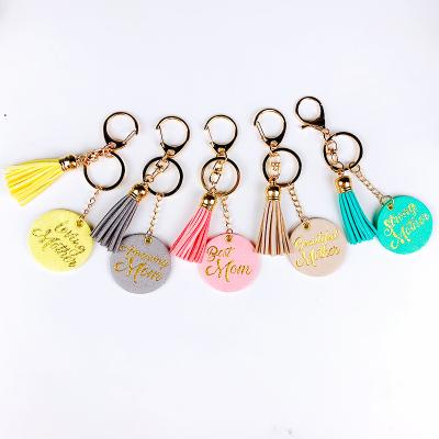 China Natural and Cool Custom Souvenir Key Chain with Handmade Foil Tassel Bag Pendant for sale