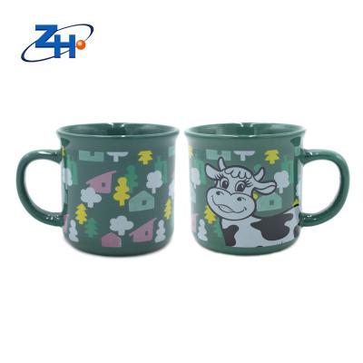 China Sustainable high quality printed green cute little dairy cow handled ceramic mug for drink for sale