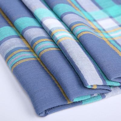 China Sustainable Running Twisted Yarn Dyed Fabric Cotton Blend Plaid Crepe Linen Fabric for sale