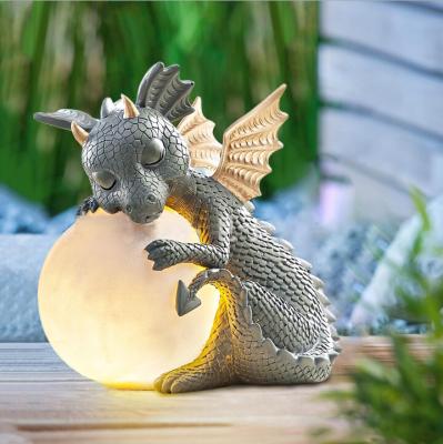 China New Creative Cute Europe Amazon Dragon Sculpture Decorative Outdoor Garden Lighting Resin Crafts& Ornaments &Art Sculpture for sale