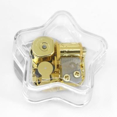 China Playing the sound wholesale transparent star acrylic music box rotating gift low price factory direct sales creative marketing souvenir for sale