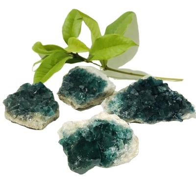 China Europe Wholesale Price Natural Green Fluorite Group Rough Stone Crystal Minerals for sale