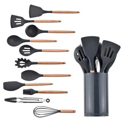 China Best Selling High End Sustainable 11PCS Silicone Kitchen Utensils Sets Cooking Instruments With Plastic Holder for sale