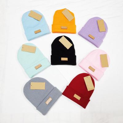 China COMMON designer Winter Plain Dyed Beanie Hat made to order 100% Beanie Hat With Leather Tag knitted warm acrylic for sale