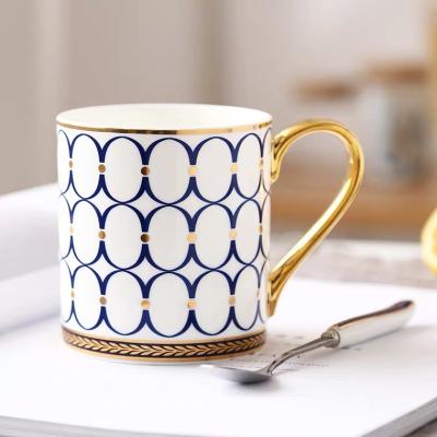 China Sustainable Wholesale Nordic Luxury Blue White Porcelain Coffee Mug With Gold Handle for sale