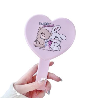 China Customized Magnifying Elegant Heart Shaped Portable Bag Mirrors Red Heart Magic Mirror for sale