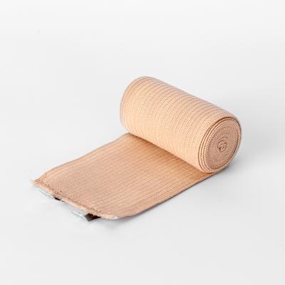 China Medical Adhesive Cotton Rayon Cotton Tape Medical Wrap Cohesive Muscle Bandage for sale