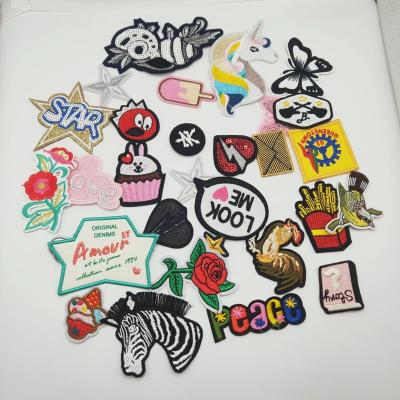 China custom 3D fabric embroidered patch badges sew on embroidery patches for apparel for sale