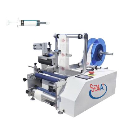 China Food semi-automatic syringe labeling machine for sale