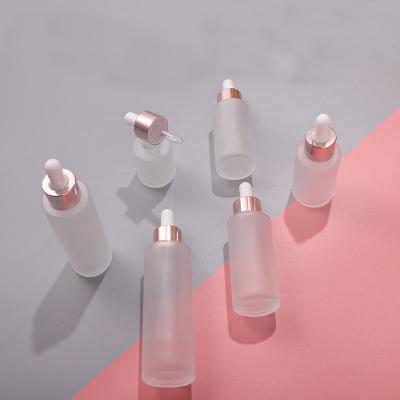 China OEM Personal Skin Care Private Label Packaging Skin Care Cosmetic Wrap Around Empty Essential Oil Bottle Rose Gold Frosting Dropper Glass Bottle for sale