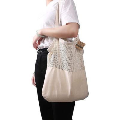 China Nordic Style Cotton Eco-friendly Handled Mesh Recycle Shopping Bags Canvas Hanging Shopping Bag for sale