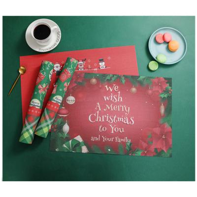 China 2021 Hot Selling Christmas Red Online Christmas Place Mat PVC Hot Selling Western Place Mat Viable for sale