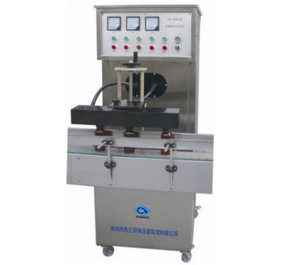 China Food Easy To Operate High Efficiency Well Sealing Plastic Bottle Glass Bottles Aluminum Foil Sealing Machine for sale