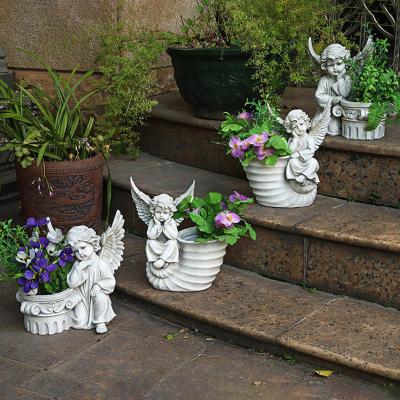 China Europe custom and wholesale Nordic succulent garden outdoor courtyard balcony flowerpot angel landscape resin craft plant gardening pot for sale