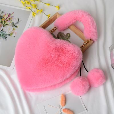 China 100% Eco-friendly/Durable Winter Faux Fur Handbags For Women Wholesale Heart Shape Clips Popular Fashion Shoulder Chain Bag for sale