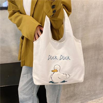 China Eco-friendly Cute Duck Cartoon Tote Bag Student Large Capacity Canvas Bag One Shoulder Bag for sale