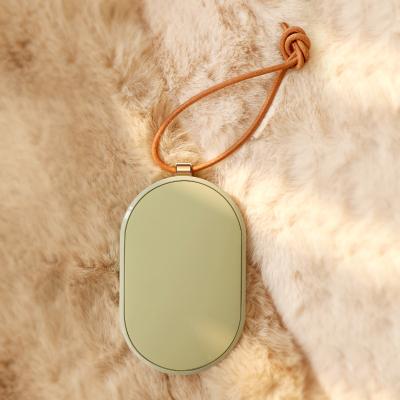 China Convenient 5000mAh Fluorite Shaped Winter Battery Operated Hand Warmer Power Bank for sale