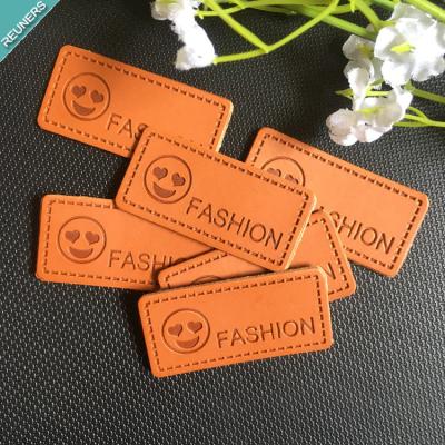 China Viable Wholesale Custom Printed Logo Embossed Jeans Leather Patches For Clothing For Bags for sale