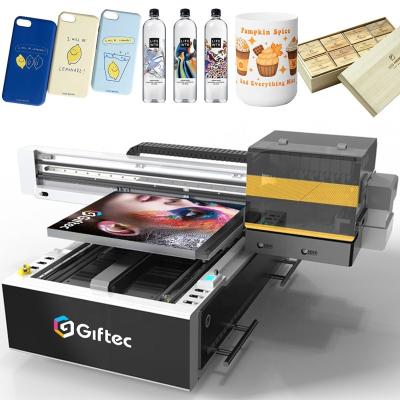 China Hotels Giftec factory price digital UV printer 6090 A1 uv led flatbed DTF printer for golf ball phone case wood mug bottle card printer for sale