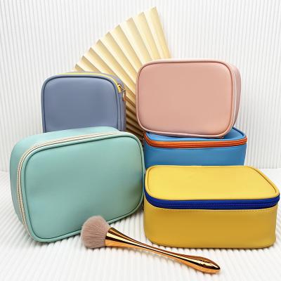 China Durable 2023 New Korean Flat Pu Morandi Waterproof Convenient Makeup Bag Pouch Lady Travel Square Professional Cosmetics Storage Bag for sale