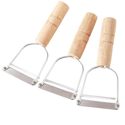 China Wholesale Disposable Low Price Old Fashioned Wooden Fruit and Vegetable Peelers Stainless Steel Peelers Cutting Knives for sale