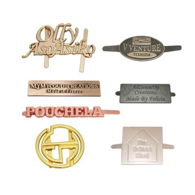 China Metal bag brand logo metal label accessories zinc alloy custom engraved name plates for wallet for sale