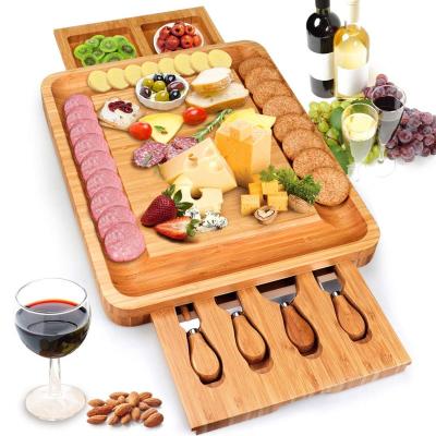 China MJ Hot Selling Large Cheese Cutter Dishes Board Stocked Bamboo Set And Knife Set With Hidden Slide Drawers Charcuterie Tray Wooden Board for sale